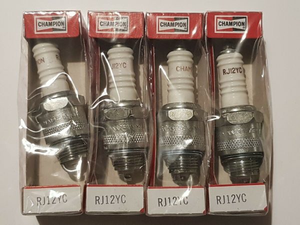 Set of four new Champion RJ12YC (stock - 14) Spark Plugs